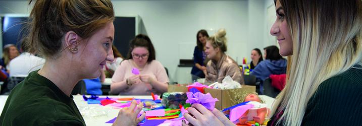 Childcare students taking part in an art and crafts class.