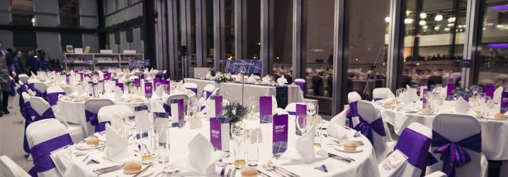 Tables laid for an event Tables laid for an event