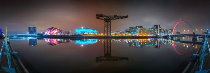 An image of town at night, over the river Clyde, showcasing a beautiful Glasgow.