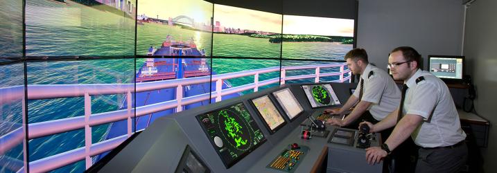 Nautical students in ships simulator.