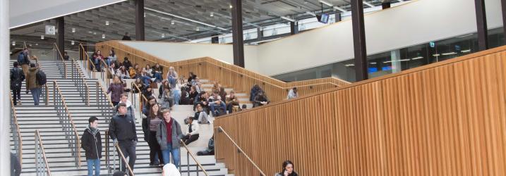 Students in atrium at City campus.